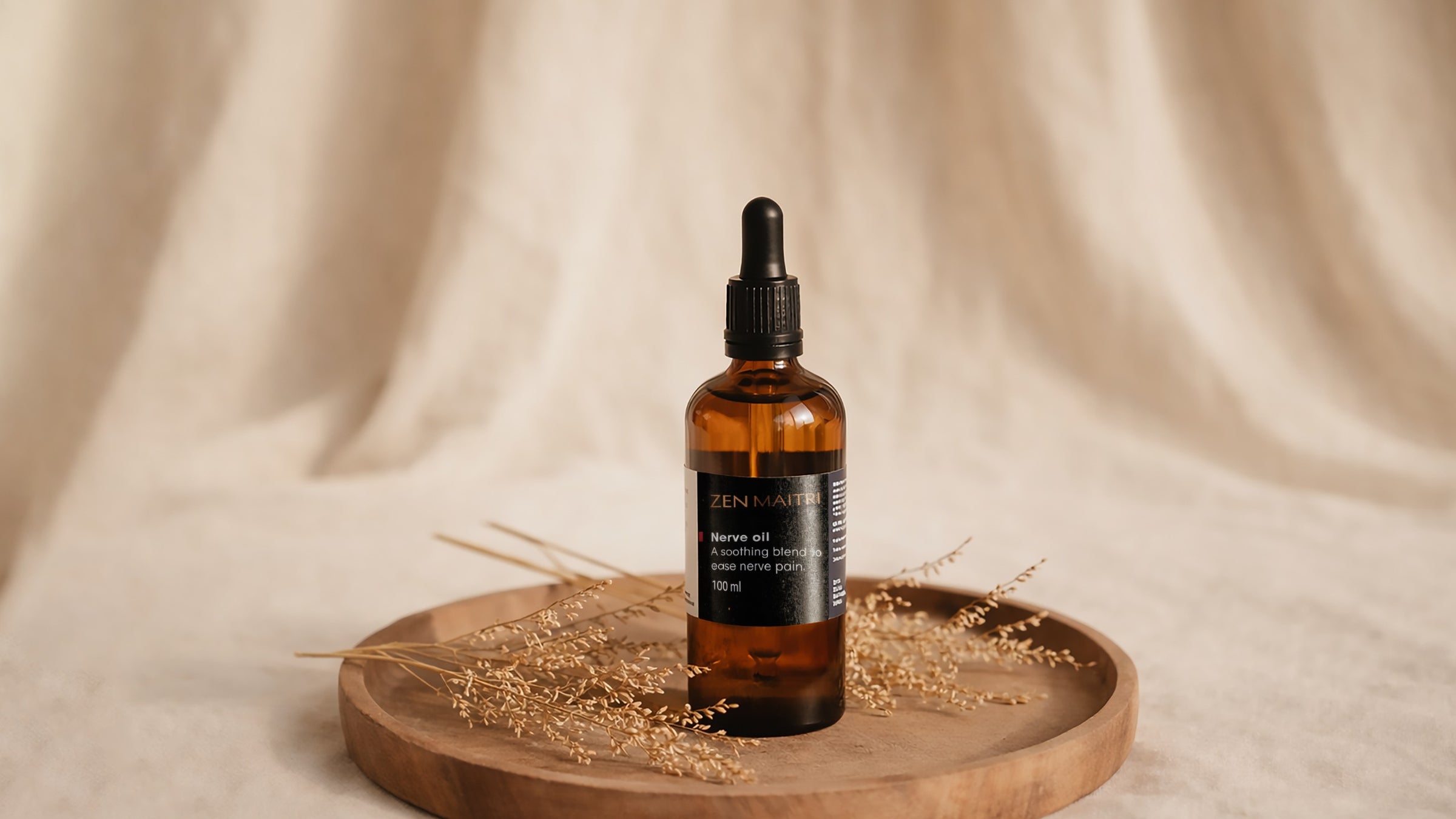 Bottle of ZENRIN skincare serum on a wooden tray with a beige fabric background