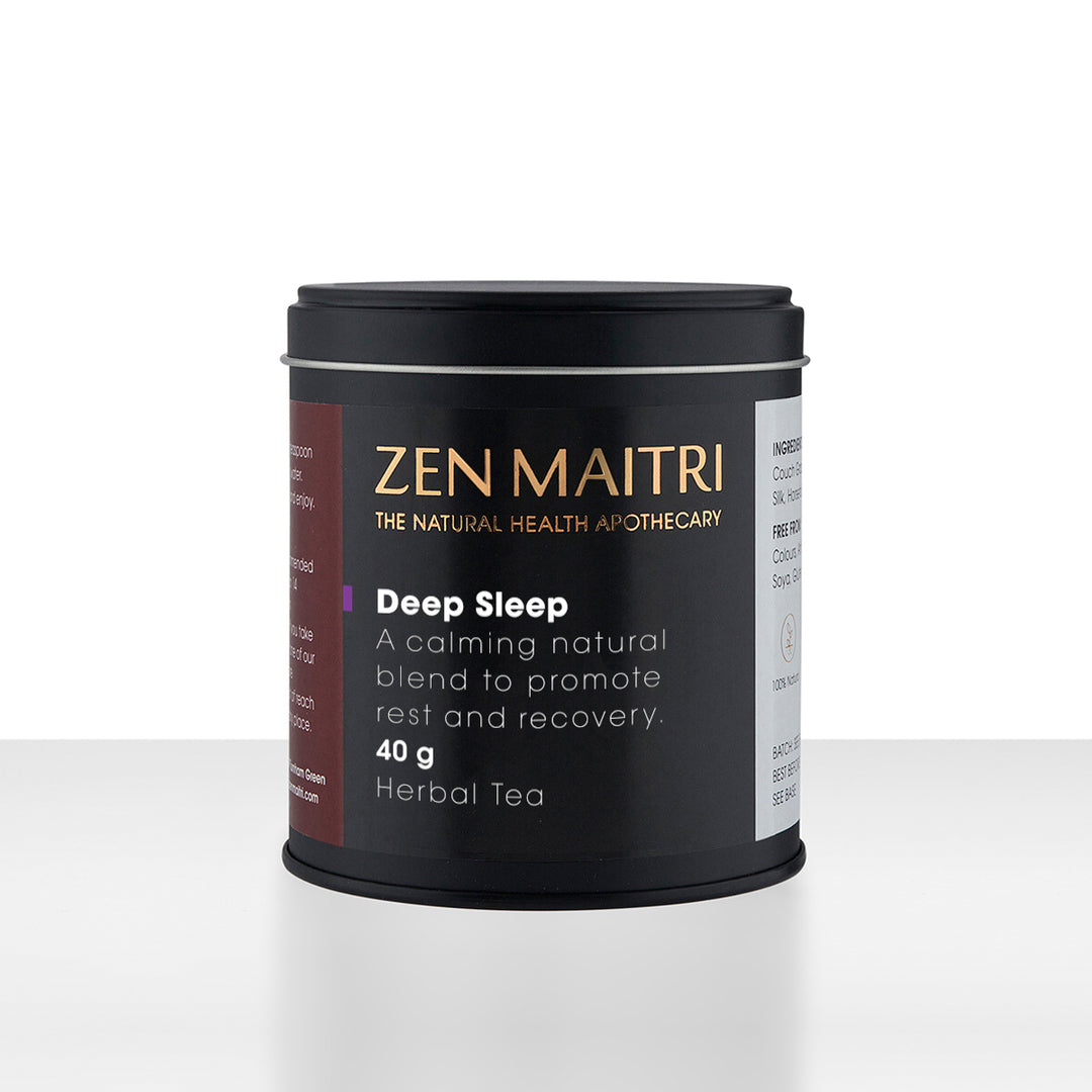 Zen Maitri Headease herbal tea in a matte black cylindrical tin with a matching lid, set against a clean white background with a subtle reflection.