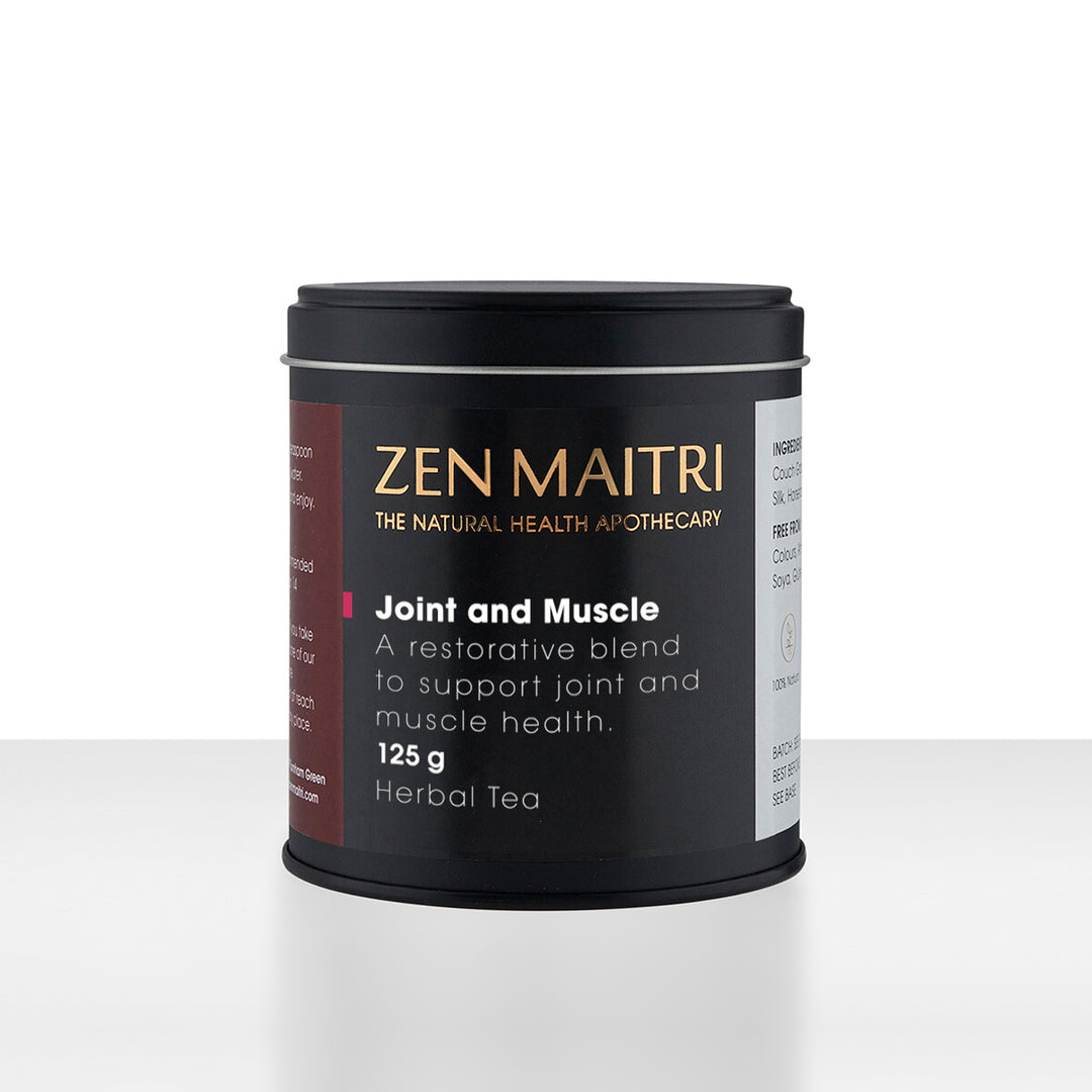 Zen Maitri Joint and Muscle Herbal Tea in a matte black cylindrical tin with a matching lid, set against a clean white background with a subtle reflection.